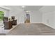 This large bedroom has carpeted floors and a built-in desk for an office space at 155 Grace Hope Dr, Brooks, GA 30205