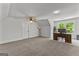 This large bedroom has carpeted floors, a ceiling fan, and a built-in desk for an office space at 155 Grace Hope Dr, Brooks, GA 30205