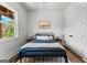 Comfortable bedroom with natural light, hardwood floors, and neutral decor at 155 Grace Hope Dr, Brooks, GA 30205