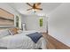 Bedroom featuring hardwood floors, two windows, ceiling fan, and natural light at 155 Grace Hope Dr, Brooks, GA 30205