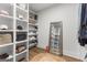 Well-organized walk-in closet with custom shelving and a full-length mirror at 155 Grace Hope Dr, Brooks, GA 30205