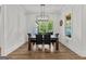 Dining room with black dining set and large windows offering a view of the outdoors at 155 Grace Hope Dr, Brooks, GA 30205