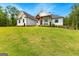 Two story home on a beautiful lot with a large lawn and a covered front porch at 155 Grace Hope Dr, Brooks, GA 30205
