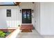 Charming front entrance with brick steps and dark double doors at 155 Grace Hope Dr, Brooks, GA 30205