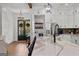 Bright, open kitchen with a large island, stainless steel appliances, and double french doors at 155 Grace Hope Dr, Brooks, GA 30205