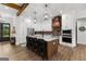 Spacious kitchen with stainless steel appliances, brick backsplash, large island and an eat in kitchen at 155 Grace Hope Dr, Brooks, GA 30205