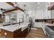 Bright, open kitchen with a large island, stainless steel appliances, and brick backsplash at 155 Grace Hope Dr, Brooks, GA 30205