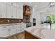 Gourmet kitchen with quartz countertops, stainless steel appliances, a brick backsplash, and custom cabinets at 155 Grace Hope Dr, Brooks, GA 30205