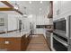 Bright, open kitchen with a large island, stainless steel appliances, and lots of storage space at 155 Grace Hope Dr, Brooks, GA 30205
