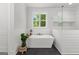 Modern bathroom with freestanding tub, large window, sleek fixtures, and contemporary design at 155 Grace Hope Dr, Brooks, GA 30205