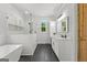 Modern bathroom with soaking tub, walk-in shower, double vanity, and stylish, contemporary design at 155 Grace Hope Dr, Brooks, GA 30205
