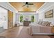 Charming bedroom featuring a wood ceiling, ceiling fan, and sliding barn door to the bathroom at 155 Grace Hope Dr, Brooks, GA 30205
