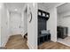 Mudroom features a bench with storage and an adjacent laundry room at 155 Grace Hope Dr, Brooks, GA 30205
