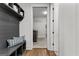 Mudroom bench with storage and an entrance to the laundry room at 155 Grace Hope Dr, Brooks, GA 30205