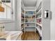 Walk in pantry with lots of built in shelves, storage solutions, and room for lots of groceries at 155 Grace Hope Dr, Brooks, GA 30205