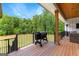 Spacious deck with grill offering serene outdoor views and comfortable seating; perfect for entertaining at 155 Grace Hope Dr, Brooks, GA 30205