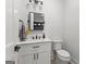 Clean powder room with white vanity and contrasting black fixtures at 155 Grace Hope Dr, Brooks, GA 30205