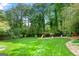 Large backyard featuring a green lawn and a playground at 1533 High Haven Ne Ct, Atlanta, GA 30329