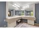 Bathroom featuring a dual vanity, storage, tile flooring, and a large mirror at 1533 High Haven Ne Ct, Atlanta, GA 30329