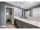Bathroom features a double sink vanity, a large mirror, and a door leading to the toilet and shower at 1533 High Haven Ne Ct, Atlanta, GA 30329