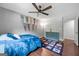 Bedroom boasting hardwood floors, a blue dresser, and wall pennants at 1533 High Haven Ne Ct, Atlanta, GA 30329