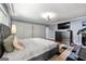 Comfortable bedroom with carpet, television, queen bed, ceiling fan, and closet at 1533 High Haven Ne Ct, Atlanta, GA 30329