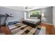 Well-lit bedroom with hardwood floors, ceiling fan, and a comfortable queen-sized bed at 1533 High Haven Ne Ct, Atlanta, GA 30329