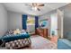 Inviting bedroom with hardwood floors, dresser, window, and decor at 1533 High Haven Ne Ct, Atlanta, GA 30329