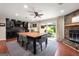 Dining area with a large table, fireplace, and access to the outdoor patio for al fresco dining at 1533 High Haven Ne Ct, Atlanta, GA 30329