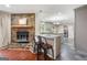 Kitchen with stone fireplace, island with seating, gray cabinets, and stainless steel appliances at 1533 High Haven Ne Ct, Atlanta, GA 30329