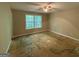 Spacious bedroom with a ceiling fan and a large window offering natural light at 261 Sally Duke Dr, Whitesburg, GA 30185