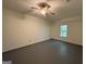 Spacious bedroom with ceiling fan and window at 261 Sally Duke Dr, Whitesburg, GA 30185