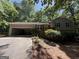Inviting home with a well-maintained lawn, complemented by a garage and a landscaped entrance at 261 Sally Duke Dr, Whitesburg, GA 30185