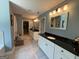 This bathroom boasts granite countertops, -and- sinks, and recessed lighting, providing a luxurious and functional space at 8340 Nolandwood Ln, Villa Rica, GA 30180