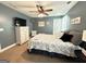 This bedroom features neutral walls, plush carpeting, and a ceiling fan, providing comfort and style at 8340 Nolandwood Ln, Villa Rica, GA 30180