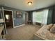 This bedroom offers ample natural light, neutral walls, and plush carpeting, creating a cozy and bright space at 8340 Nolandwood Ln, Villa Rica, GA 30180