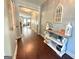 Inviting foyer with hardwood floors, soft blue walls, and decorative accents at 8340 Nolandwood Ln, Villa Rica, GA 30180