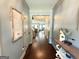 Inviting foyer with hardwood floors, soft blue walls, and decorative accents at 8340 Nolandwood Ln, Villa Rica, GA 30180
