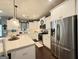 Well-lit modern kitchen with stainless steel appliances and stylish white cabinetry at 8340 Nolandwood Ln, Villa Rica, GA 30180