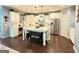 Spacious kitchen featuring bright white cabinetry, stainless steel appliances, and a large center island with seating at 8340 Nolandwood Ln, Villa Rica, GA 30180