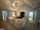 Comfortable living room featuring a large sectional sofa, vaulted ceiling, and neutral color palette at 8340 Nolandwood Ln, Villa Rica, GA 30180