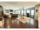 Bright, open-concept living space featuring wood floors, living, dining, and fireplace views at 8340 Nolandwood Ln, Villa Rica, GA 30180