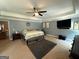 This main bedroom offers generous space, a tray ceiling, neutral walls, and modern lighting, providing a luxurious retreat at 8340 Nolandwood Ln, Villa Rica, GA 30180