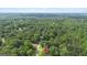 Aerial view of property with lush greenery and red location pin at 160 Country Mill Ln, Stockbridge, GA 30281