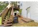 Backyard view featuring a deck, stairs, patio seating, storage shed, and entrance to the home at 160 Country Mill Ln, Stockbridge, GA 30281