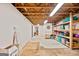 Unfinished basement with exposed beams and storage shelving, ready for customization at 160 Country Mill Ln, Stockbridge, GA 30281