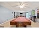 Spacious basement featuring a pool table, ceiling fans, and exterior access at 160 Country Mill Ln, Stockbridge, GA 30281