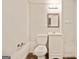 Simple bathroom features a toilet, vanity with a mirror, and clean fixtures at 160 Country Mill Ln, Stockbridge, GA 30281