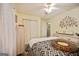 Bedroom with a unique clock, large closet, light-colored walls, and artwork at 160 Country Mill Ln, Stockbridge, GA 30281