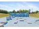 Outdoor fitness course area featuring obstacles, bars, and varied climbing apparatus with a bright blue surface and sunny sky above at 160 Country Mill Ln, Stockbridge, GA 30281